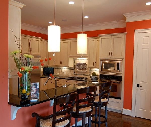 ایده های طراحی آشپزخانه با دیوارهای نارنجی و ابزار گلویی سفید